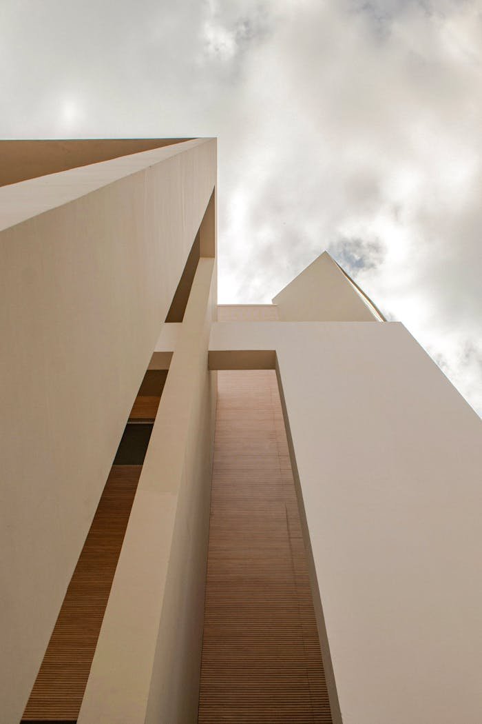 our-journey-01 Abstract view of a modern building with geometric shapes and natural light.